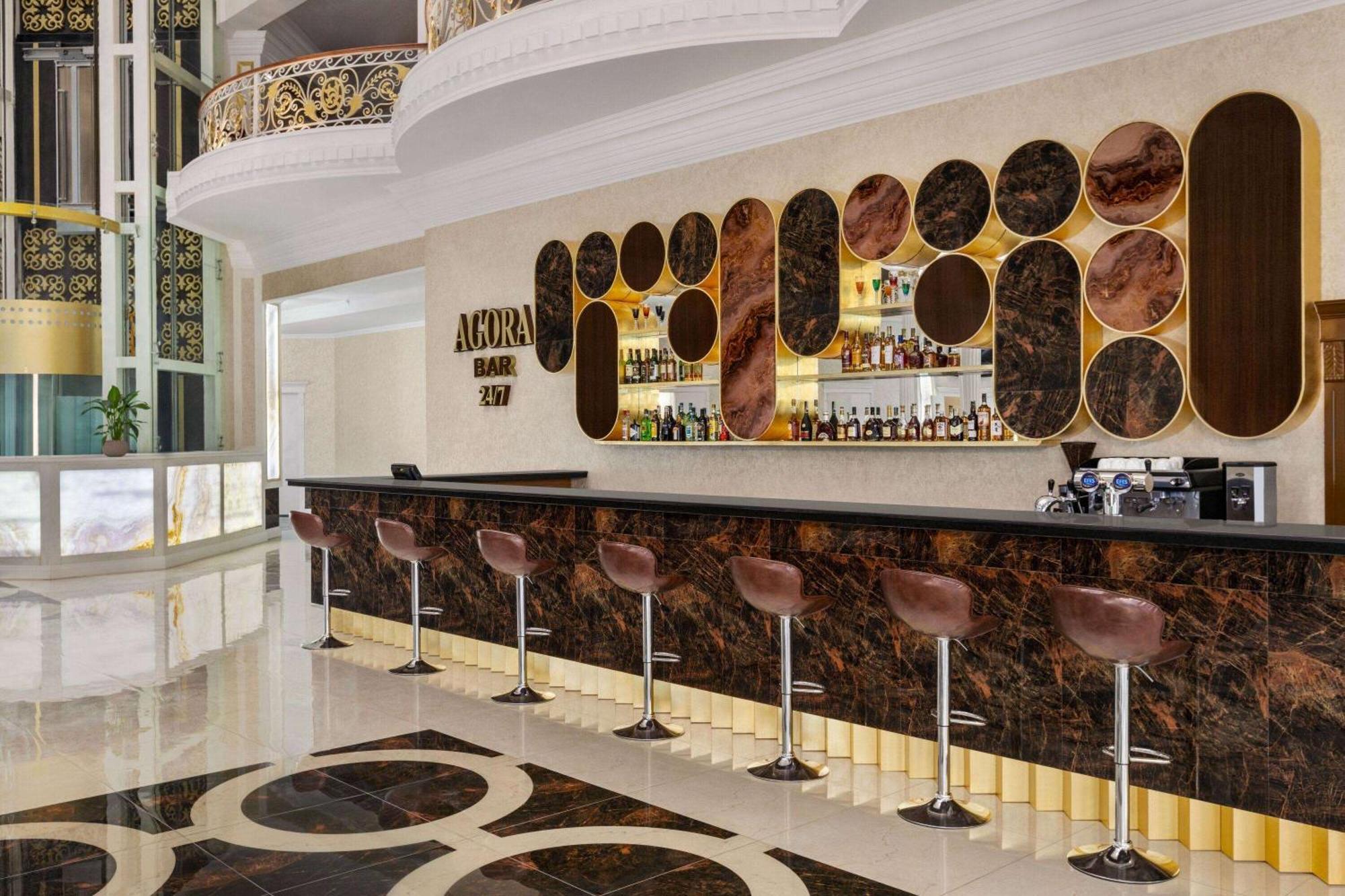 Hotel Ramada By Wyndham Chimkent Extérieur photo